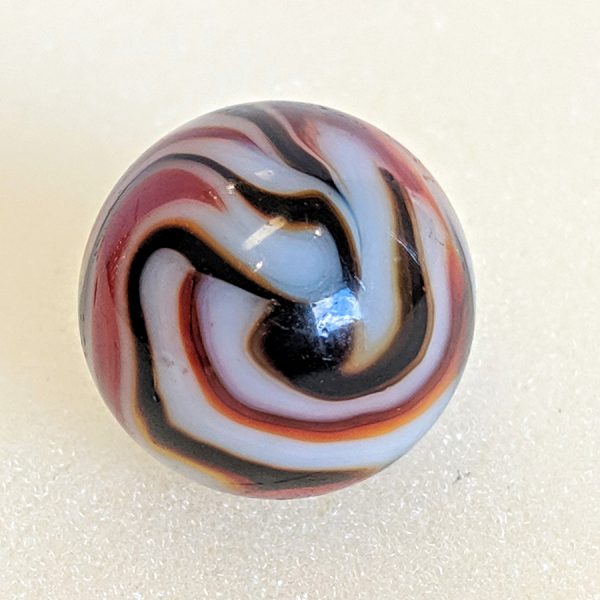 Terrific swirly pattern of blended red and black with light aventurine on a white base.