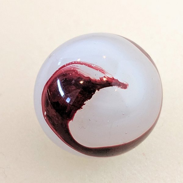 Great "Playful Cat" pattern of oxblood on a translucent white base with submarine oxblood in areas. Excellent size